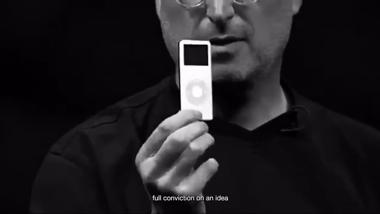 Steve Jobs holding an iPod